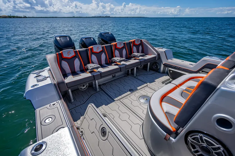 Slide: The Image of 2012 Yellowfin 39 boat interior with seating, ocean view, and multiple outboard engines. - 29