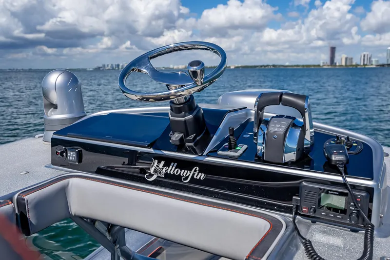 Slide: The Image of 2012 Yellowfin 39 boat helm with steering wheel, controls, and ocean view. - 36