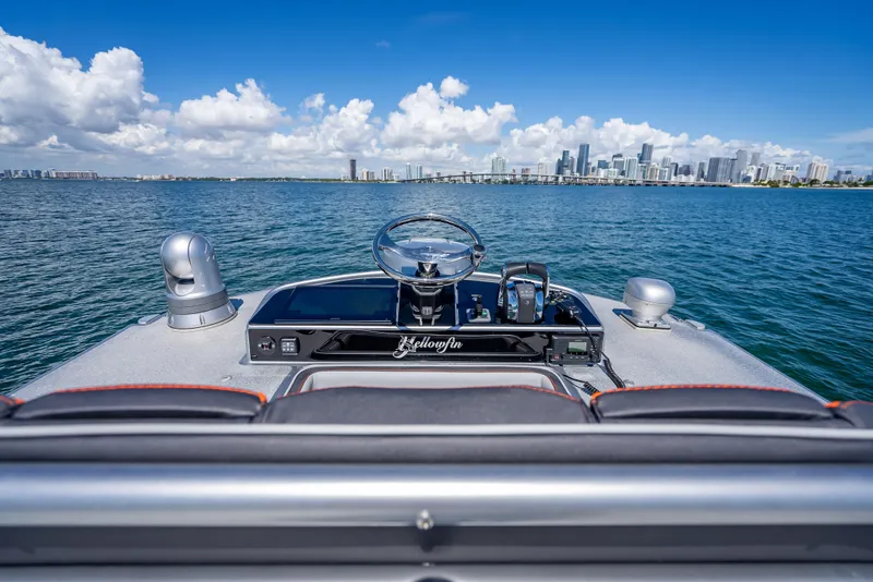 Slide: The Image of 2012 Yellowfin 39 boat dashboard with city skyline in the background. - 38
