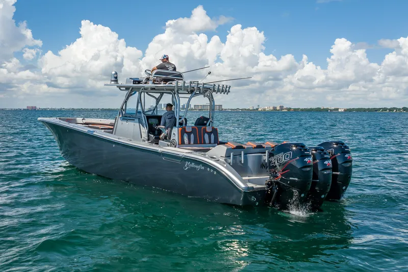 Slide: The Image of 2012 Yellowfin 39 boat on open water, featuring multiple outboard engines. - 4