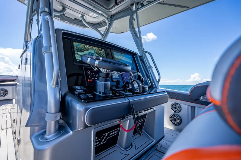 Slide: The Image of 2012 Yellowfin 39 boat cockpit with advanced navigation system and ocean view. - 40