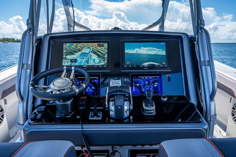 Slide: The Image of 2012 Yellowfin 39 boat dashboard with advanced navigation and control systems. - 45