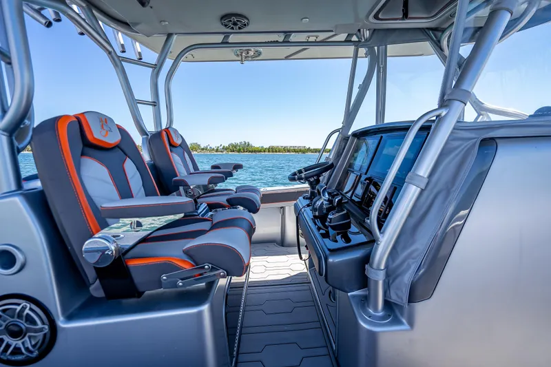 Slide: The Image of 2012 Yellowfin 39 boat interior with modern seating and navigation controls. - 47