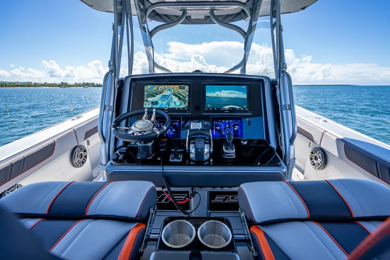 Slide: The Image of 2012 Yellowfin 39 boat cockpit with advanced navigation system and ocean view. - 49