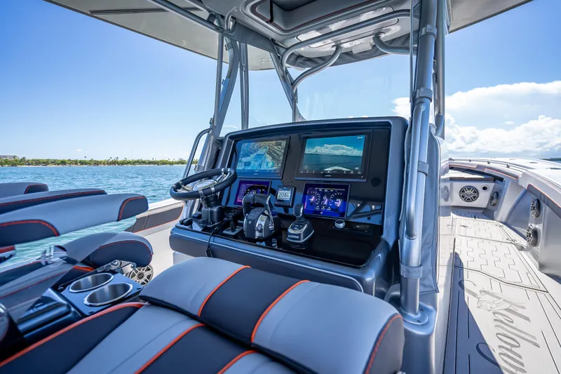 Slide: The Image of Interior view of 2012 Yellowfin 39 boat cockpit with advanced navigation system. - 51