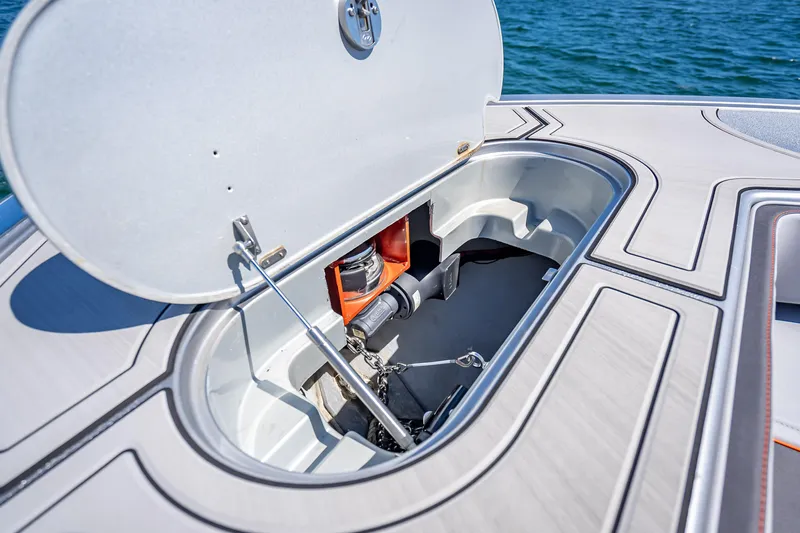 Slide: The Image of Open hatch on 2012 Yellowfin 39 boat, revealing storage compartment and equipment. - 53