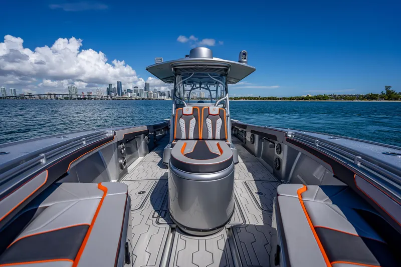 Slide: The Image of 2012 Yellowfin 39 boat interior with city skyline in background, under clear blue sky. - 54