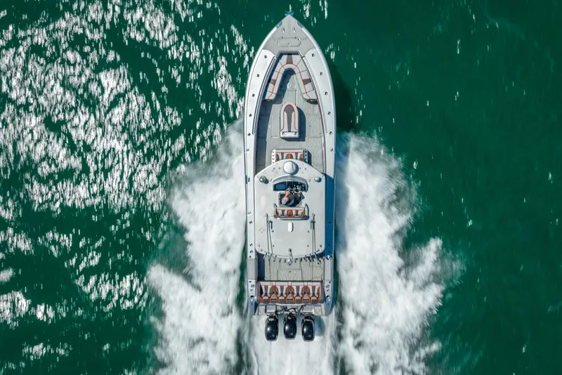 Slide: The Image of Aerial view of 2012 Yellowfin 39 boat speeding on vibrant green water. - 63