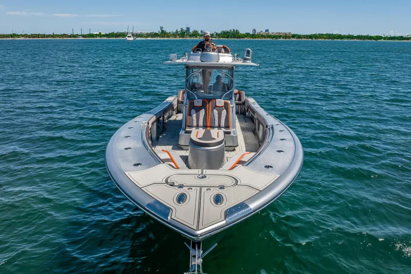 Slide: The Image of 2012 Yellowfin 39 boat on open water, sleek design, clear day. - 65