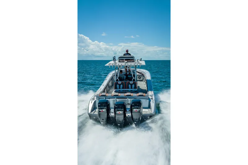 Slide: The Image of 2012 Yellowfin 39 boat cruising on open water with powerful engines. - 66