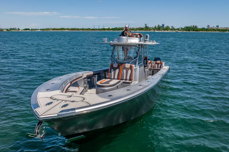 Slide: The Image of 2012 Yellowfin 39 boat on open water, featuring sleek design and modern amenities. - 69