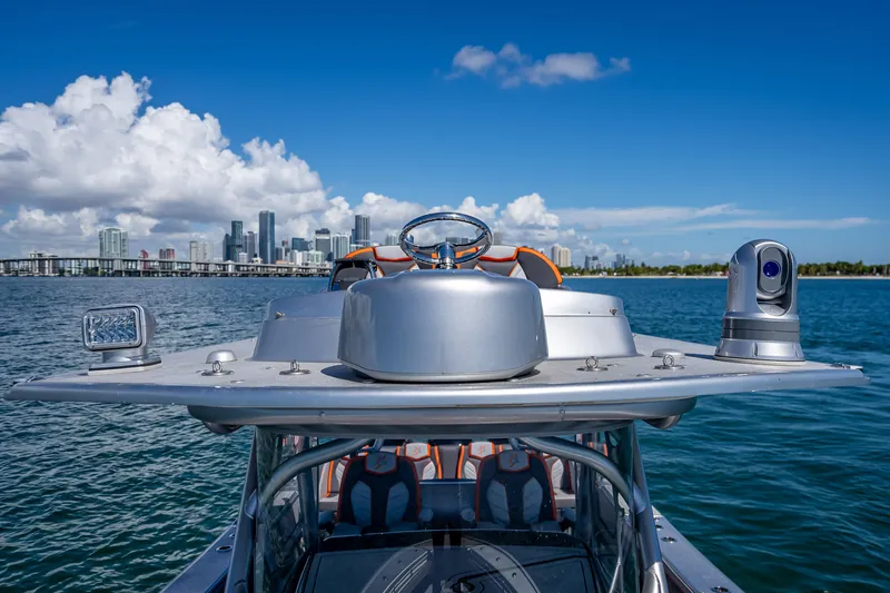 Slide: The Image of 2012 Yellowfin 39 boat on water with city skyline in background. - 7