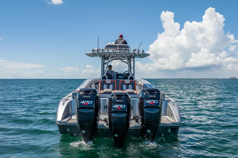 Slide: The Image of 2012 Yellowfin 39 boat with triple 400R engines cruising on open water. - 71