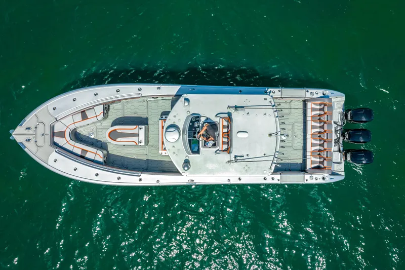 Slide: The Image of Aerial view of 2012 Yellowfin 39 boat on clear green water. - 75