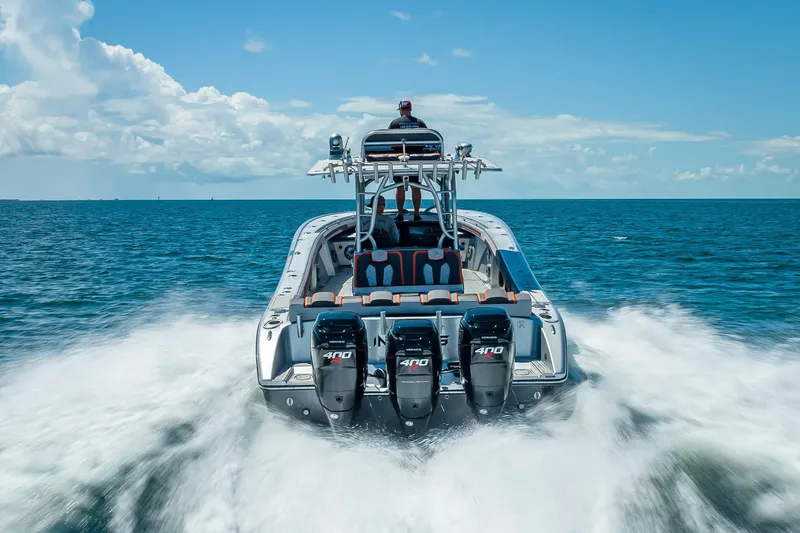 Slide: The Image of 2012 Yellowfin 39 boat speeding on open ocean with powerful engines. - 78