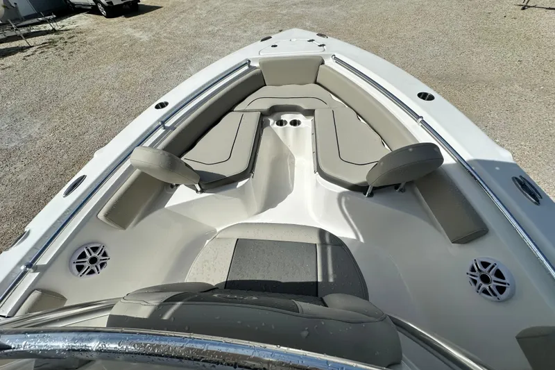 Slide: The Image of 2026 Key West 219 FS boat interior with cushioned seating and cup holders. - 11