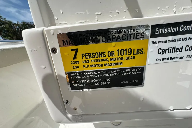 Slide: The Image of 2026 Key West 219 FS capacity label: 7 persons or 1019 lbs, 250 HP max. - 17