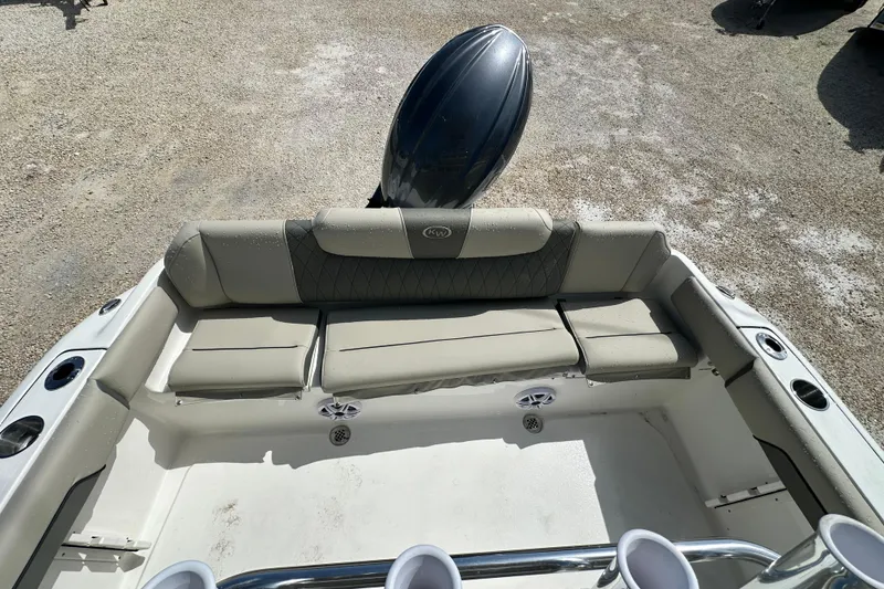 Slide: The Image of 2026 Key West 219 FS boat interior with cushioned seating and cup holders. - 8