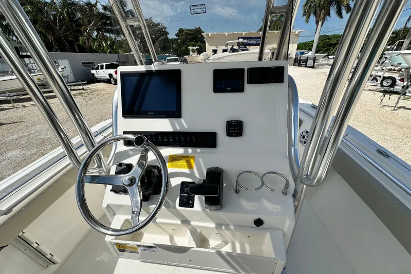Slide: The Image of 2026 Key West 219 FS boat console with steering wheel, display, and controls. - 9