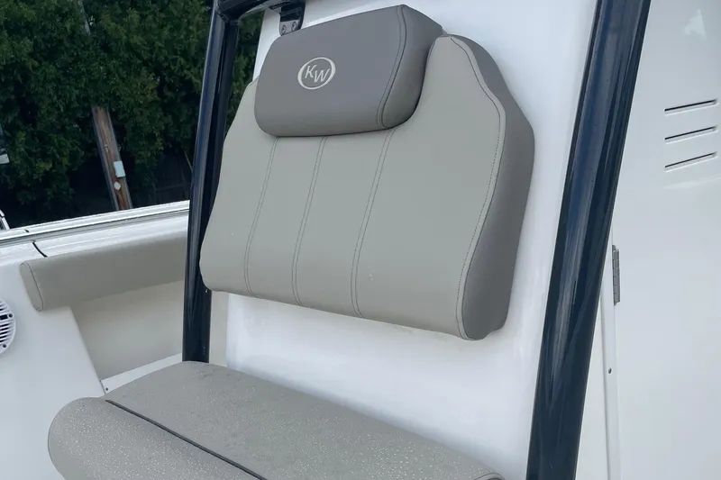 Slide: The Image of 2024 Key West 239 FS boat seat with gray upholstery and KW logo. - 11