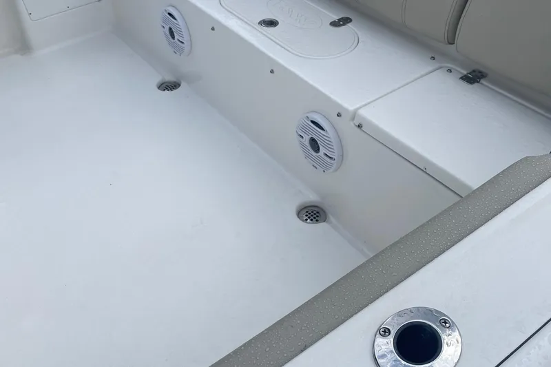 Slide: The Image of 2024 Key West 239 FS boat interior with speakers and seating area. - 9