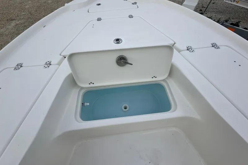 Slide: The Image of 2026 Key West 210 Bay Reef boat deck with open storage compartment. - 15