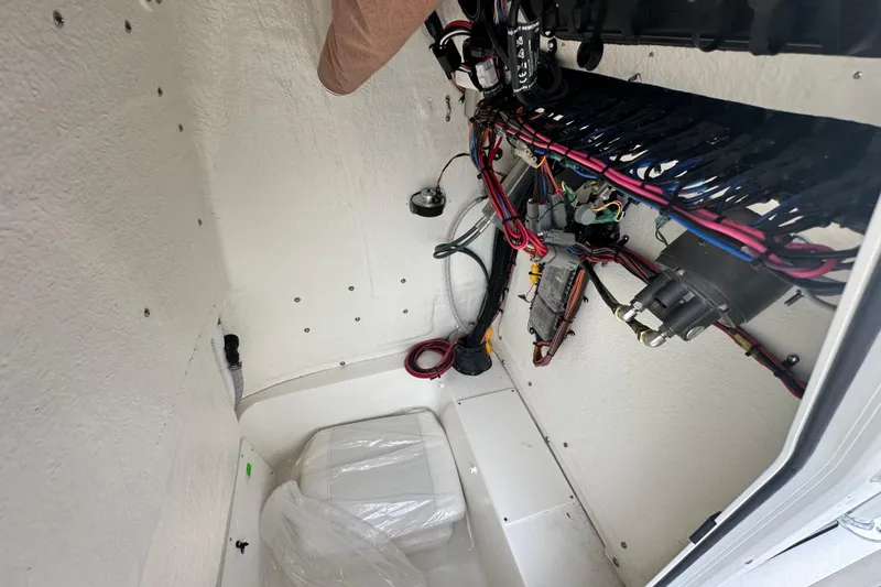 Slide: The Image of Interior wiring of 2026 Key West 210 Bay Reef boat, showcasing electrical components and cables. - 20