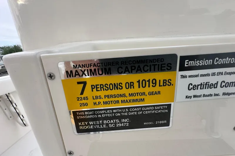 Slide: The Image of Key West 210 Bay Reef 2026 capacity label, 7 persons or 1019 lbs maximum. - 21