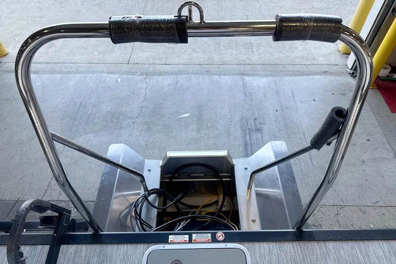 Slide: The Image of Stern view of 2026 Bennington 22 S1 Stern Radius boat with metal railing and wiring. - 10