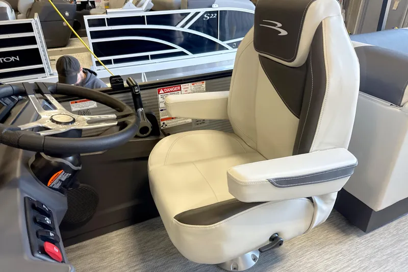 Slide: The Image of Captain's chair in 2026 Bennington 22 S1 Stern Radius boat, featuring sleek design and controls. - 7