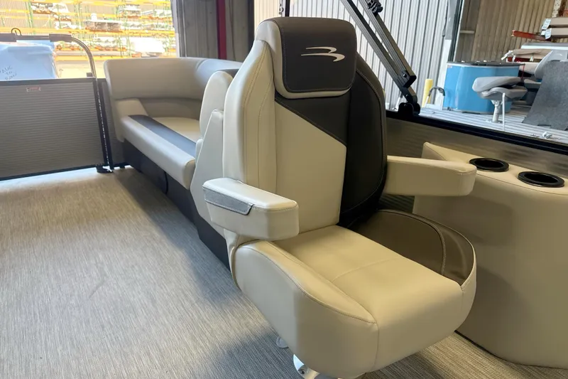 Slide: The Image of 2026 Bennington 22 S1 Stern Radius boat interior with luxurious seating and cup holders. - 8