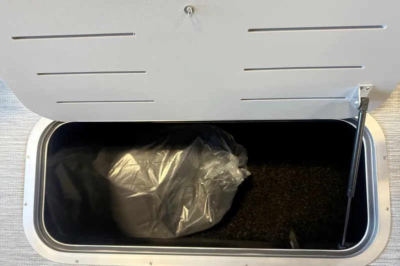 Slide: The Image of Open storage compartment in 2026 Bennington 22 S1 Stern Radius boat. - 9