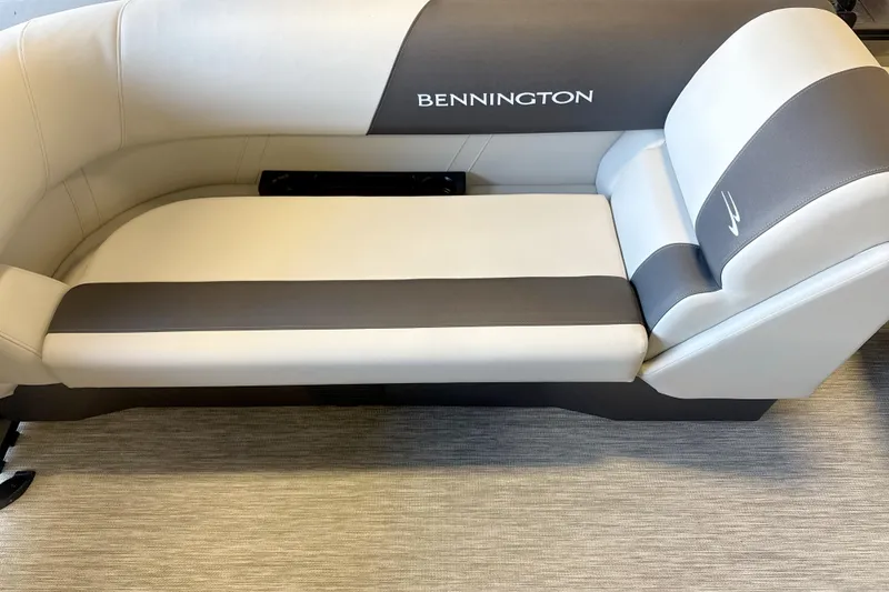 Slide: The Image of Bennington 2026 S1 22 Stern Radius boat seating, featuring elegant gray and white upholstery. - 4