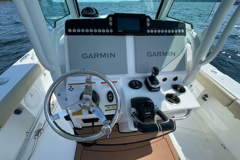 Slide: The Image of 2019 Everglades 273 Center Console boat dashboard with Garmin navigation system. - 10