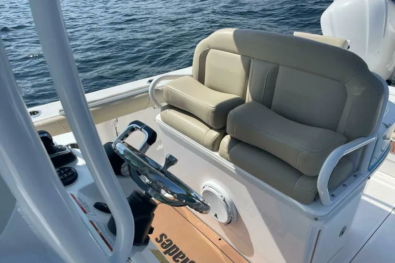 Slide: The Image of 2019 Everglades 273 Center Console boat interior with steering wheel and seating. - 15