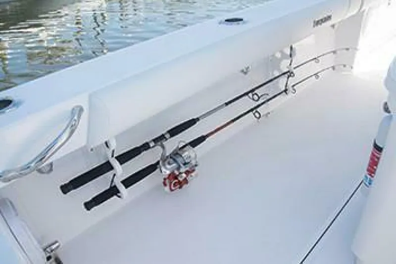 Slide: The Image of 2019 Everglades 273 Center Console boat with fishing rods secured on deck. - 18