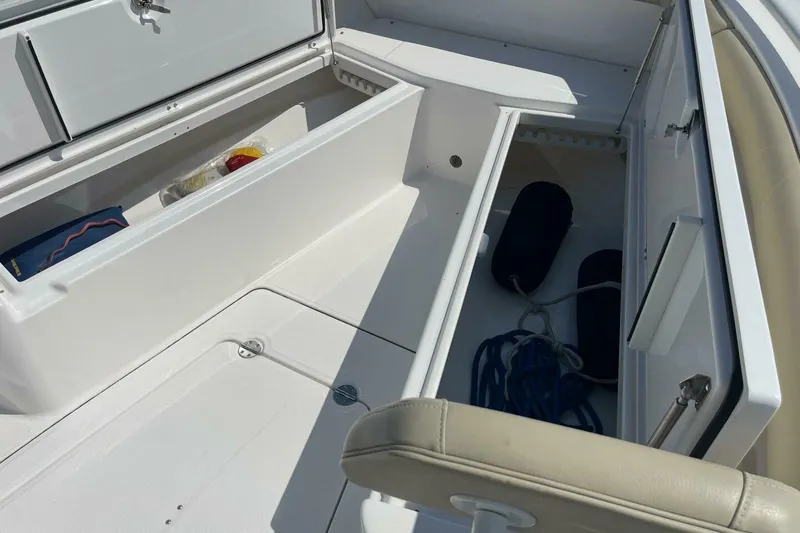 Slide: The Image of Interior storage compartments of a 2019 Everglades 273 Center Console boat. - 24