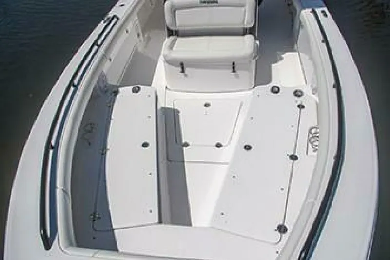 Slide: The Image of 2019 Everglades 273 Center Console boat interior with seating and storage compartments. - 25