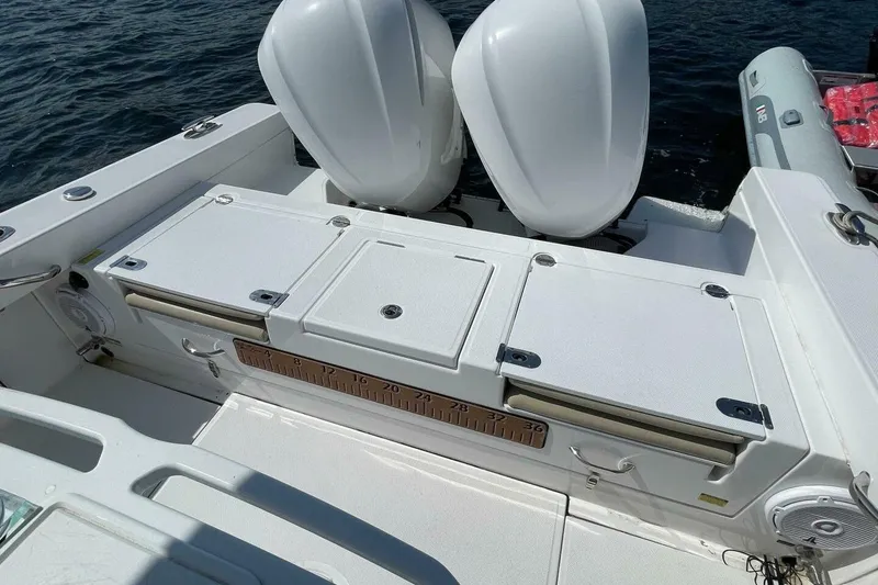 Slide: The Image of 2019 Everglades 273 Center Console boat with dual engines and storage compartments. - 6