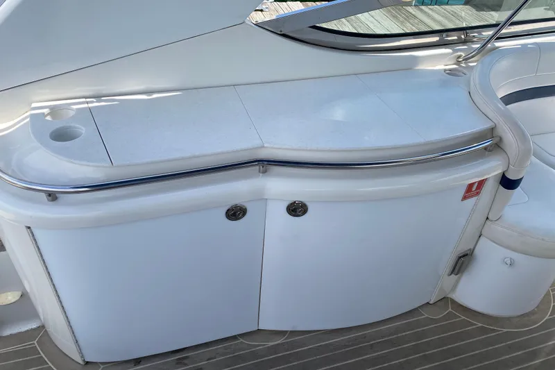 Slide: The Image of 1999 Formula 400 Super Sport yacht interior with sleek white cabinetry and seating. - 10