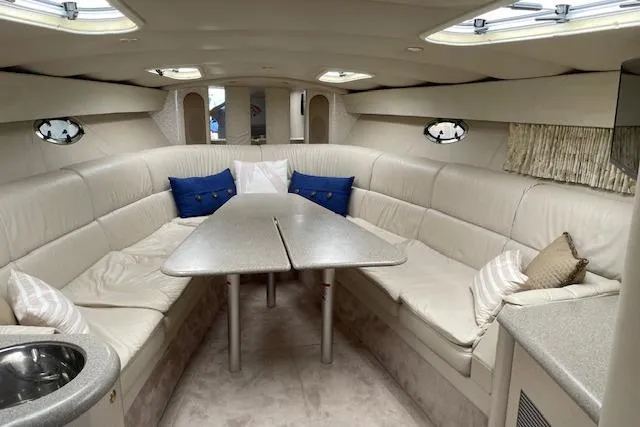 Slide: The Image of Luxurious interior of a 1999 Formula 400 Super Sport yacht with plush seating and elegant decor. - 14