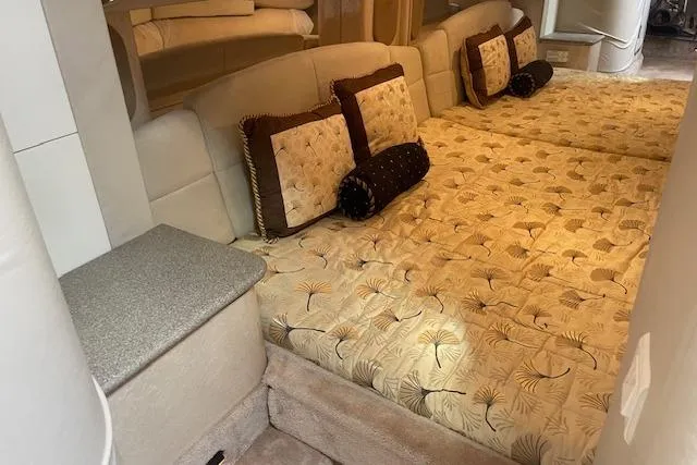 Slide: The Image of Interior of a 1999 Formula 400 Super Sport with elegant bedding and cushions. - 16