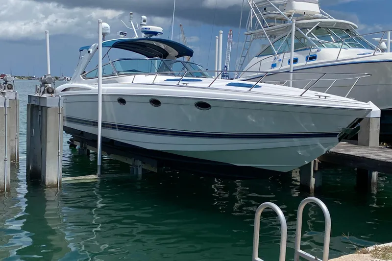 Slide: The Image of 1999 Formula 400 Super Sport boat docked in marina, front view. - 2