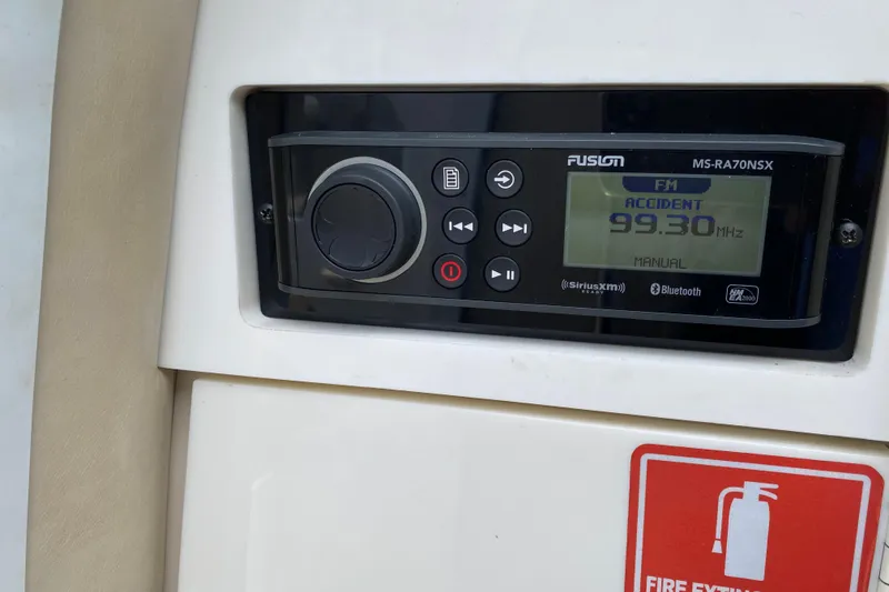 Slide: The Image of Fusion MS-RA70NSX radio on 1999 Formula 400 Super Sport boat dashboard. - 20
