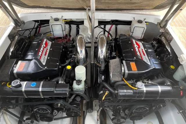 Slide: The Image of Twin engines of a 1999 Formula 400 Super Sport boat, showcasing powerful performance. - 25