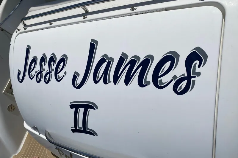 Slide: The Image of 1999 Formula 400 Super Sport boat with "Jesse James II" name on the stern. - 28