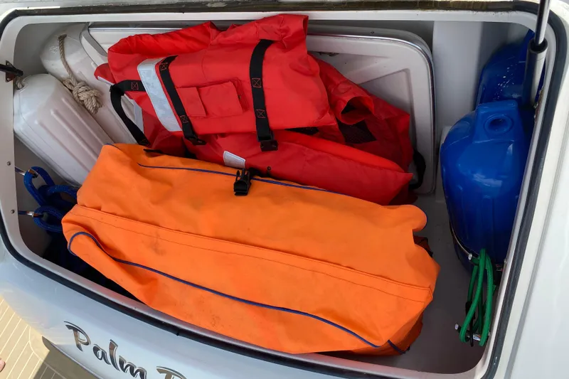 Slide: The Image of Storage compartment of 1999 Formula 400 Super Sport with life jackets and gear. - 29
