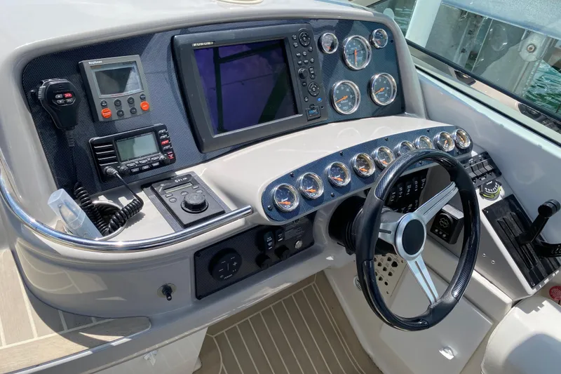 Slide: The Image of Control panel of a 1999 Formula 400 Super Sport boat with gauges and navigation equipment. - 6