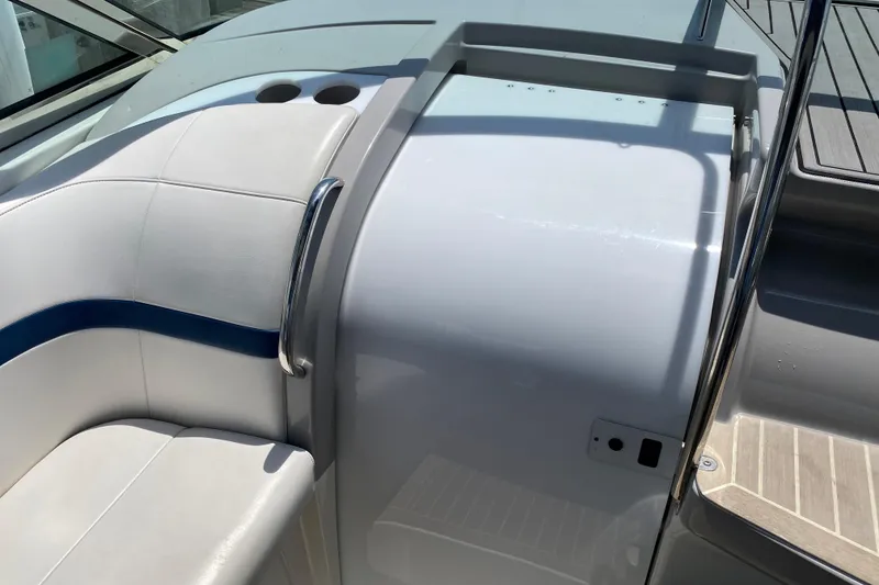 Slide: The Image of 1999 Formula 400 Super Sport boat interior with white seating and stainless steel handrail. - 7