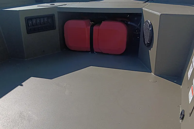 Slide: The Image of 2026 Tracker Grizzly 1650 T Prairie Wings Edition boat, olive green, parked outdoors. - 11